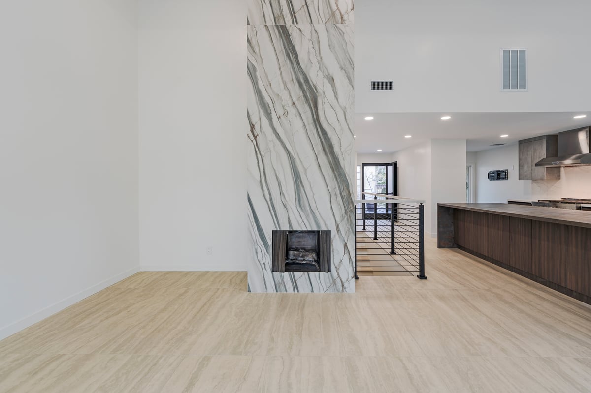 Custom-built fireplace wrapped in dramatic porcelain slab
