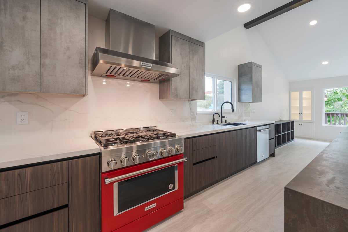 red KitchenAid range and porcelain countertop with full-height