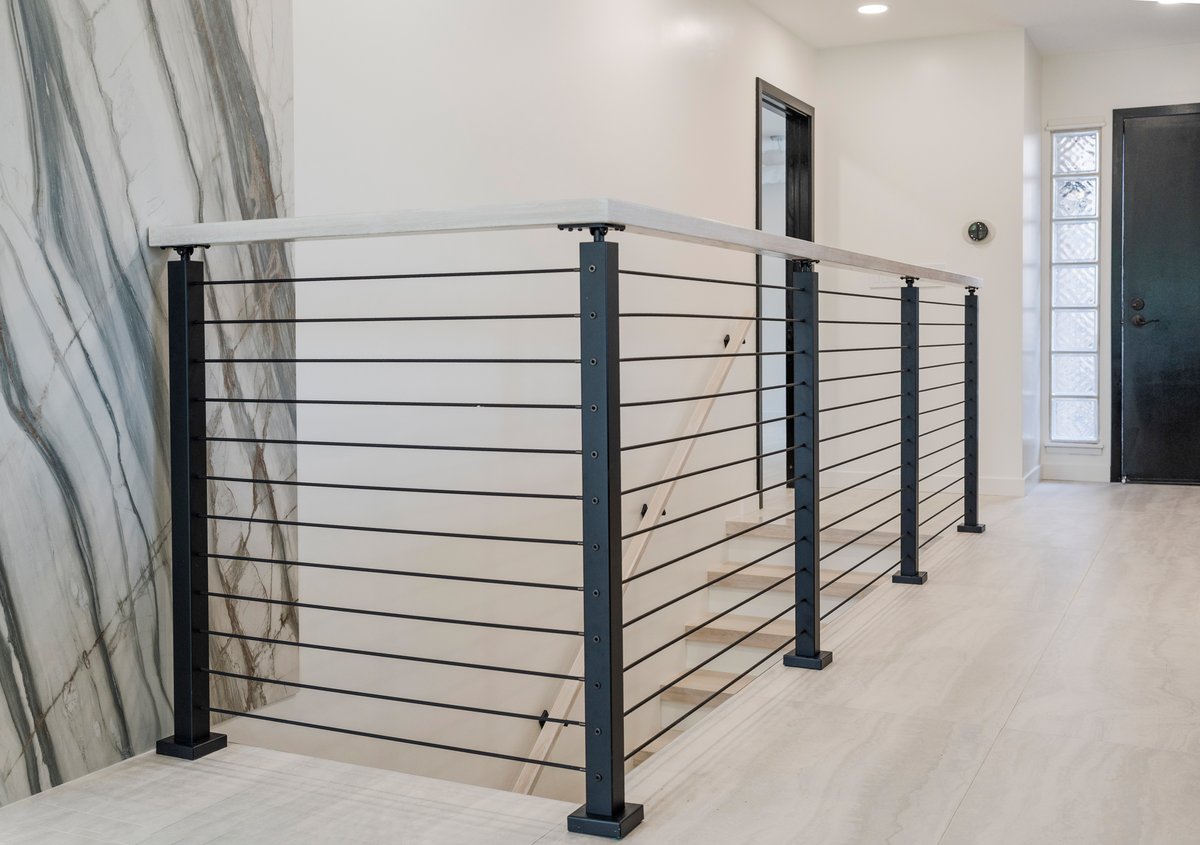 Custom hand railing wiht black tension cables.